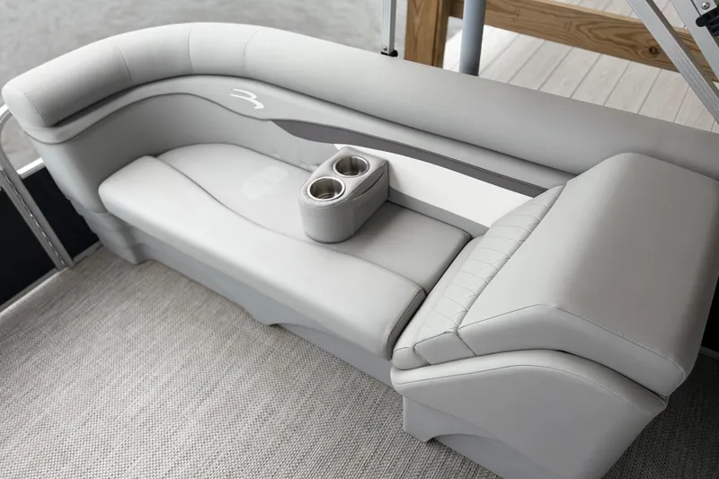 Slide: The Image of 2023 Bennington 22 SV boat interior with gray seating and cup holders. - 16