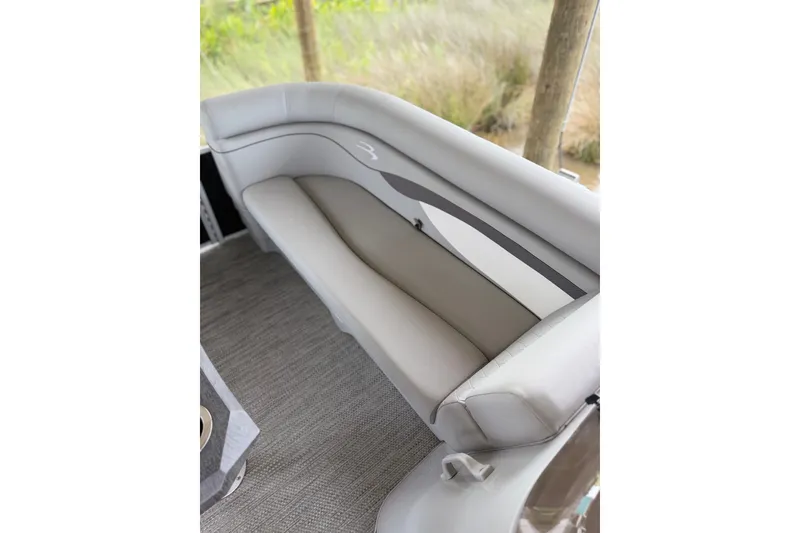 Slide: The Image of 2023 Bennington 22 SV pontoon boat interior with sleek, comfortable seating. - 21