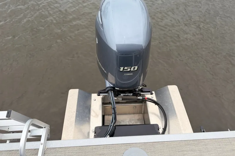 Slide: The Image of 2023 Bennington 22 SV with Yamaha 150 outboard motor on water. - 24