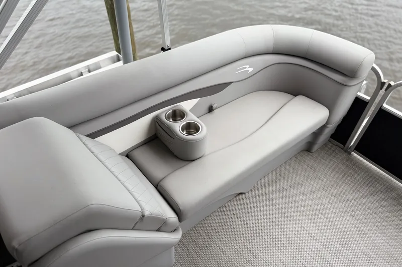 Slide: The Image of 2023 Bennington 22 SV boat interior with gray seating and cup holders. - 15