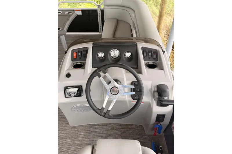 Slide: The Image of 2023 Bennington 22 SV boat dashboard with steering wheel and control panel. - 25