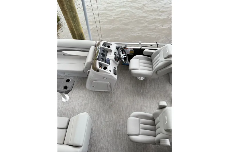 Slide: The Image of 2023 Bennington 22 SV boat interior with plush seating and modern helm. - 10