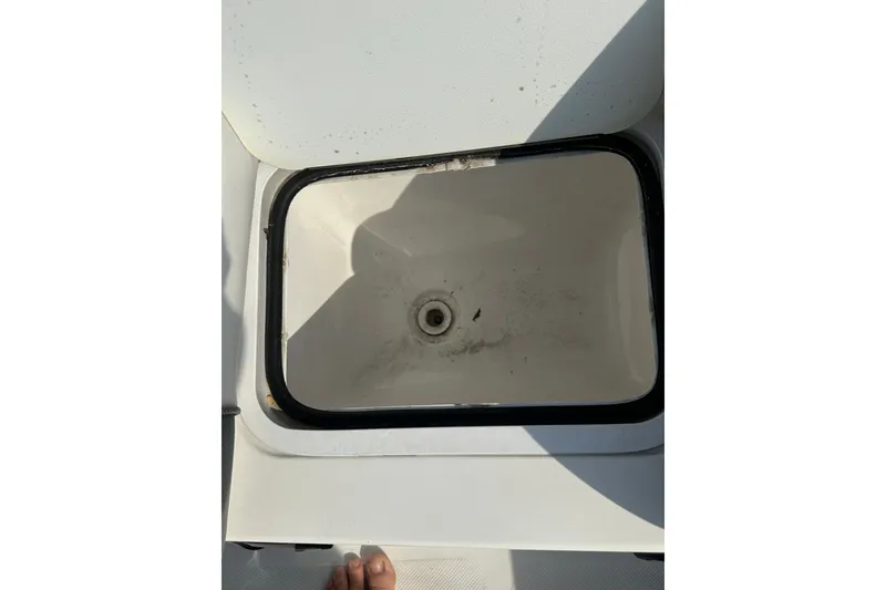 Slide: The Image of Open storage compartment on 2023 Hurricane SunDeck Sport 192 RL OB boat. - 11