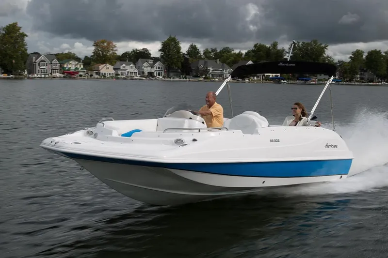 Slide: The Image of Manufacturer Provided Image: 2023 Hurricane SunDeck Sport 192 RL OB cruising on a lake with two passengers. - 32
