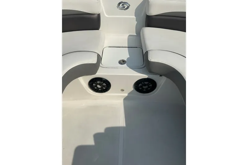 Slide: The Image of 2023 Hurricane SunDeck Sport 192 RL OB boat interior with seating and speakers. - 10