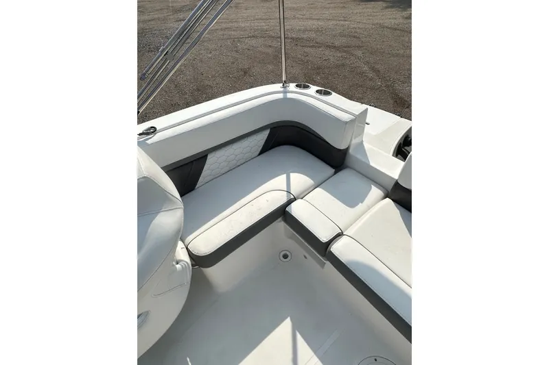 Slide: The Image of 2023 Hurricane SunDeck Sport 192 RL OB boat interior with white seating and cup holders. - 18