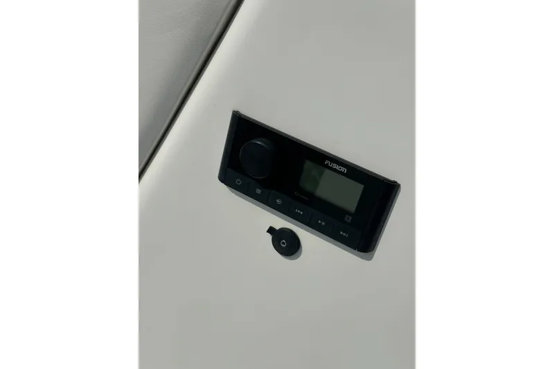 Slide: The Image of 2023 Hurricane SunDeck Sport 192 RL OB boat stereo system close-up. - 24