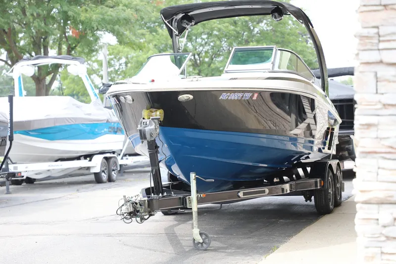 Slide: The Image of 2014 Regal 2300 RX Bowrider on trailer, parked outdoors. - 3