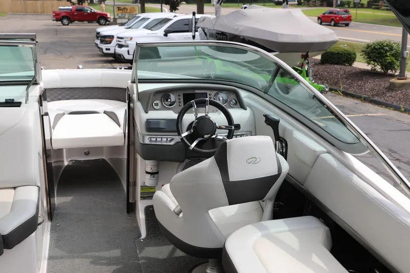 Slide: The Image of 2014 Regal 2300 RX Bowrider interior with steering wheel and seating. - 6