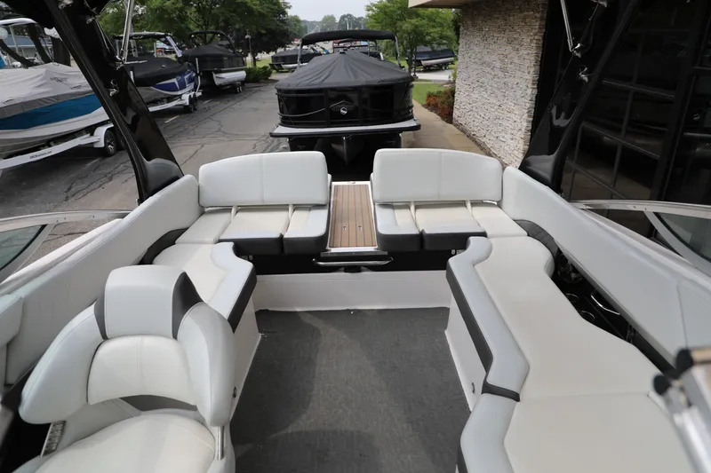 Slide: The Image of 2014 Regal 2300 RX Bowrider interior with spacious white seating and sleek design. - 7