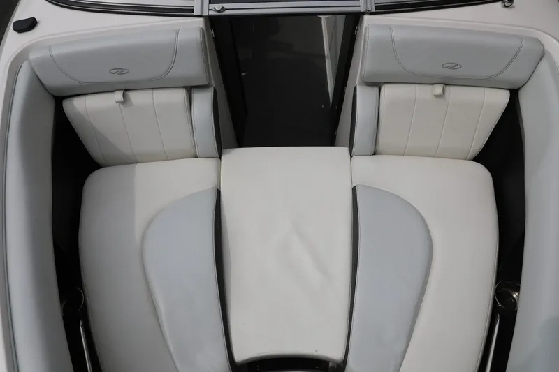 Slide: The Image of 2014 Regal 2300 RX Bowrider interior with white and gray seating. - 8