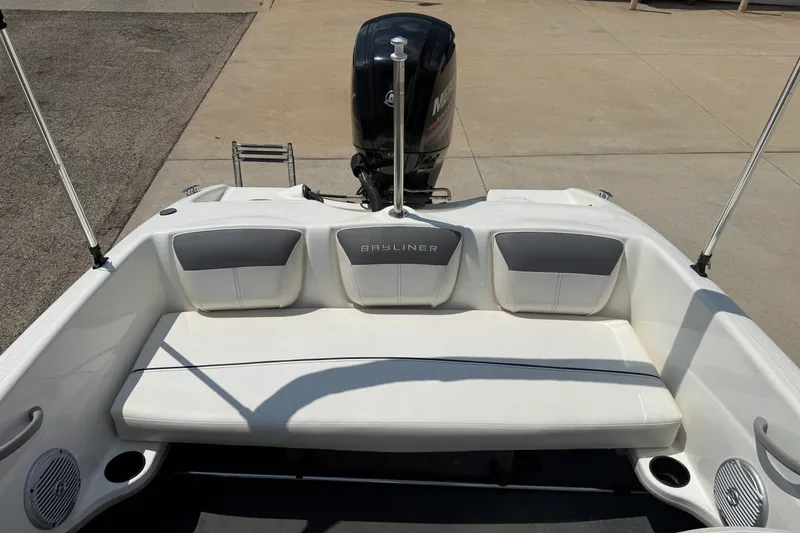 Slide: The Image of 2019 Bayliner 160 Bowrider boat interior with seating and outboard motor. - 17