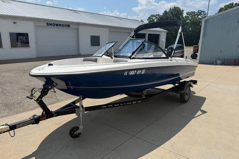 Slide: The Image of 2019 Bayliner 160 Bowrider boat on trailer outside showroom. - 3