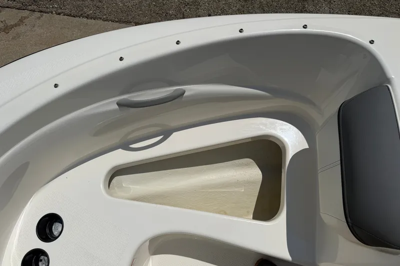 Slide: The Image of 2019 Bayliner 160 Bowrider interior detail, featuring seating and storage compartments. - 11