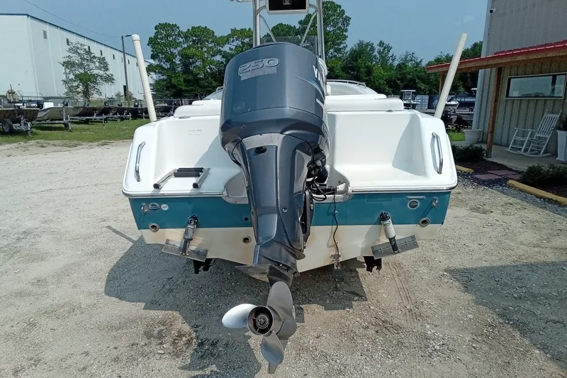 Slide: The Image of 2009 Sea Hunt Ultra 232 boat with Yamaha 250 outboard motor, parked outdoors. - 12