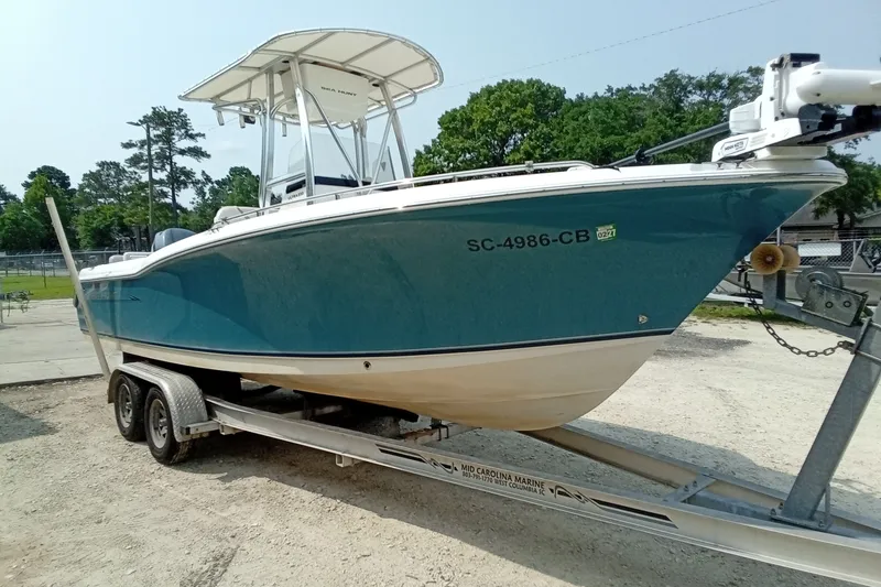 Slide: The Image of 2009 Sea Hunt Ultra 232 boat on trailer, parked outdoors. - 10