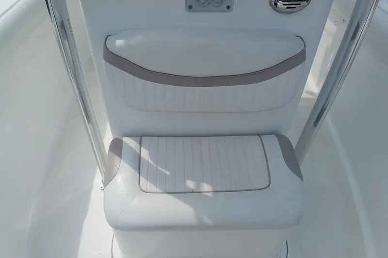 Slide: The Image of White cushioned seating on a 2009 Sea Hunt Ultra 232 boat. - 26