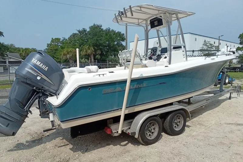 Slide: The Image of 2009 Sea Hunt Ultra 232 boat on trailer with Yamaha outboard motor. - 11