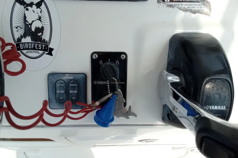 Slide: The Image of Control panel of a 2009 Sea Hunt Ultra 232 boat with Yamaha throttle. - 32
