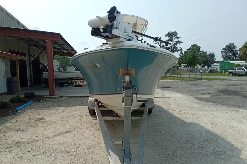 Slide: The Image of 2009 Sea Hunt Ultra 232 boat on trailer, parked outdoors near a building. - 9