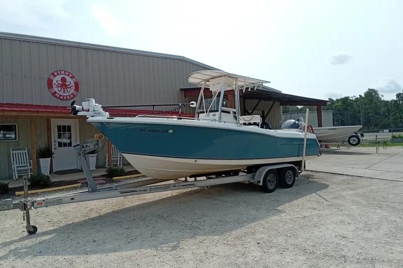 Slide: The Image of 2009 Sea Hunt Ultra 232 boat on trailer outside a building. - 6