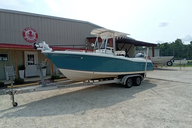 Slide: The Image of 2009 Sea Hunt Ultra 232 boat on trailer outside a building. - 7