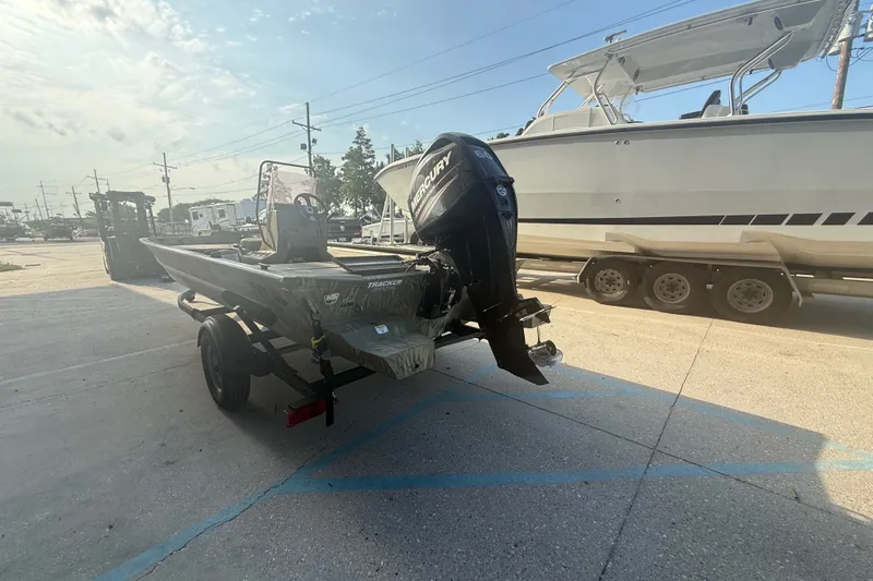 Slide: The Image of 2019 Tracker Grizzly 1860 boat with Mercury engine on trailer in parking lot. - 5