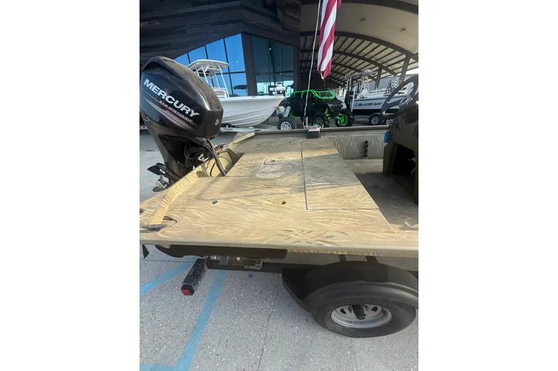 Slide: The Image of 2019 Tracker Grizzly 1860 boat with Mercury outboard motor on trailer. - 13