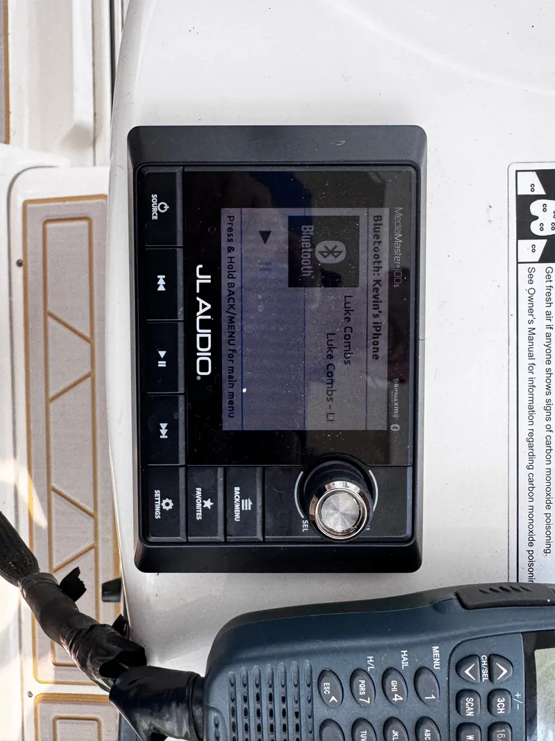 Slide: The Image of A JL Audio control unit on a boat with Bluetooth connectivity and a radio beside it. - 22