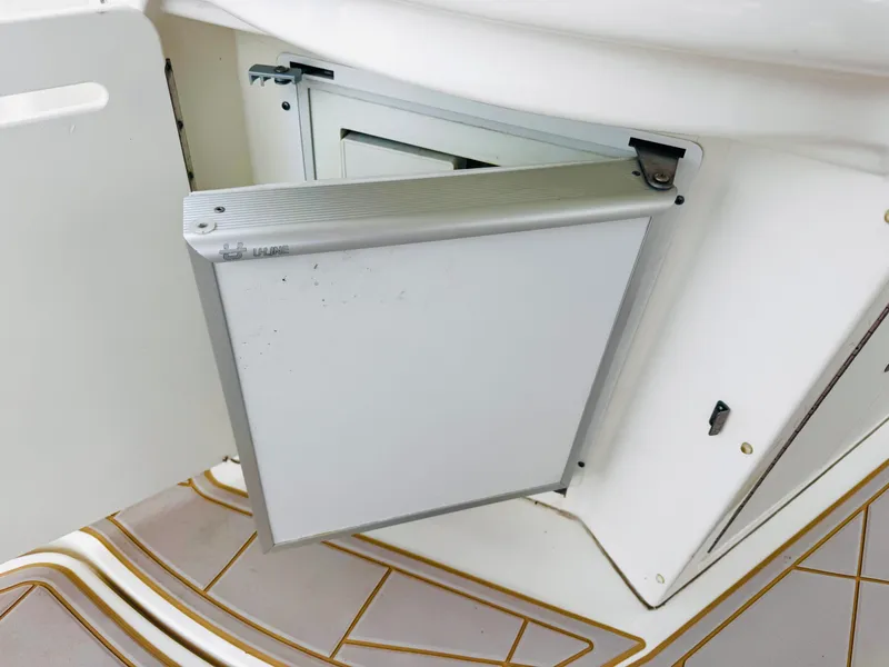 Slide: The Image of A small refrigerator is integrated into the galley of the Sea Ray 340 Sundancer. - 18