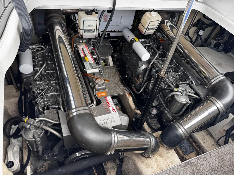 Slide: The Image of The engine room of a 2004 Formula 40 Performance Cruiser with two large engines and shiny pipes. - 22