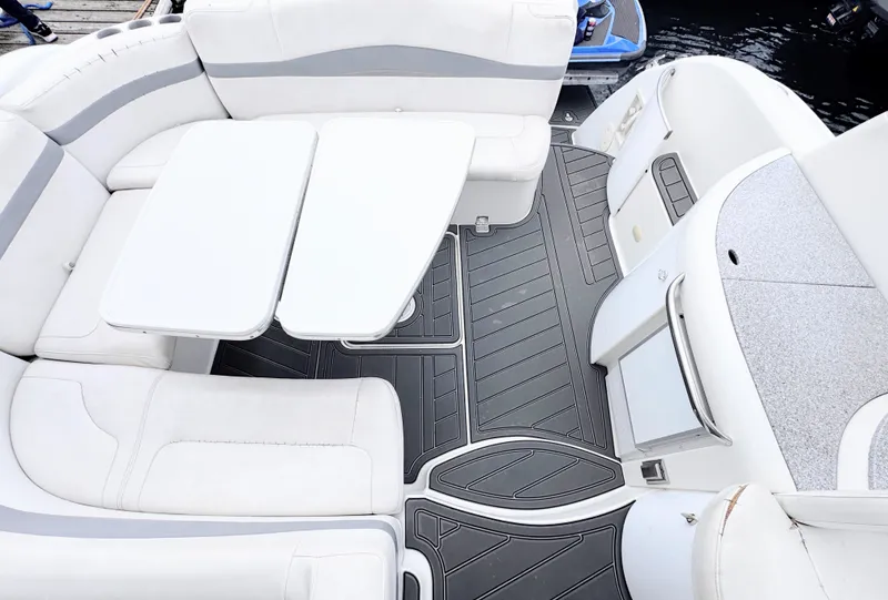 Slide: The Image of The image shows the cockpit of a 2004 Formula 40 Performance Cruiser with white upholstery and gray flooring. - 2