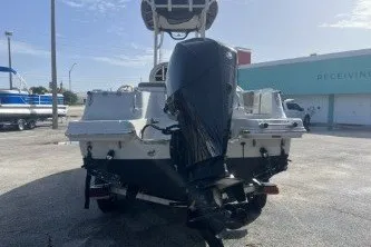 Slide: The Image of 2023 Crownline 220 CC Finseeker boat with powerful outboard motor, rear view. - 6