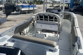 Slide: The Image of 2023 Crownline 220 CC Finseeker boat interior with seating and storage compartments. - 7