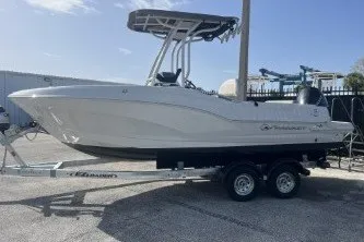 Slide: The Image of 2023 Crownline 220 CC Finseeker boat on trailer, side view. - 5
