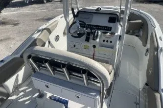 Slide: The Image of 2023 Crownline 220 CC Finseeker boat interior with steering console and seating. - 8