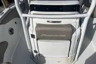 Slide: The Image of 2023 Crownline 220 CC Finseeker boat interior with seating and storage features. - 11