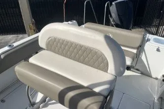 Slide: The Image of 2023 Crownline 220 CC Finseeker boat interior seating with beige upholstery. - 12