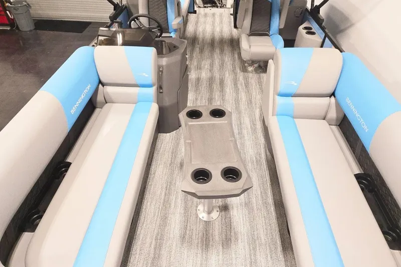 Slide: The Image of Interior of 2026 Bennington 23 S STERN RADIUS pontoon boat with blue and gray seating. - 8
