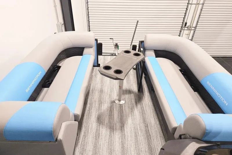Slide: The Image of 2026 Bennington 23 S STERN RADIUS boat interior with blue and gray seating. - 7