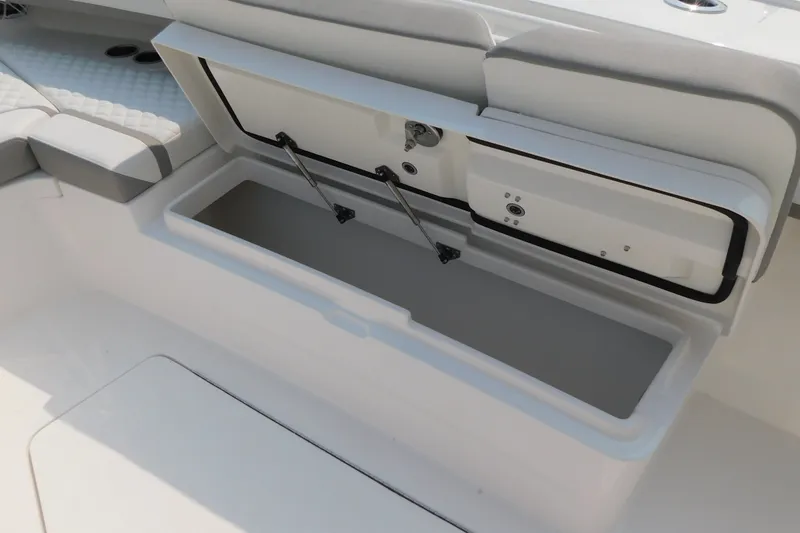 Slide: The Image of Open storage compartment on a 2026 Regulator 31 boat, showcasing interior design. - 31