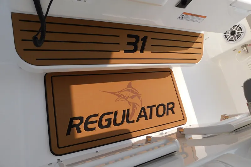 Slide: The Image of 2026 Regulator 31 boat deck with logo and model number. - 35