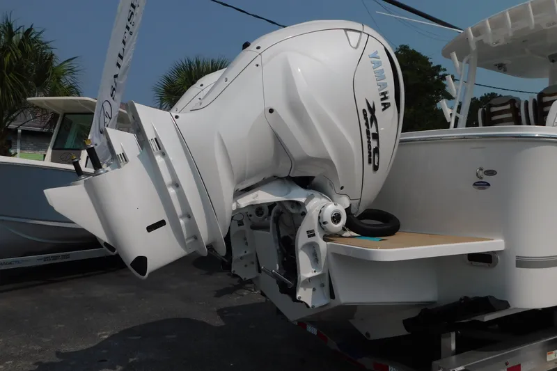 Slide: The Image of 2026 Regulator 31 boat with Yamaha XTO outboard engine displayed outdoors. - 51