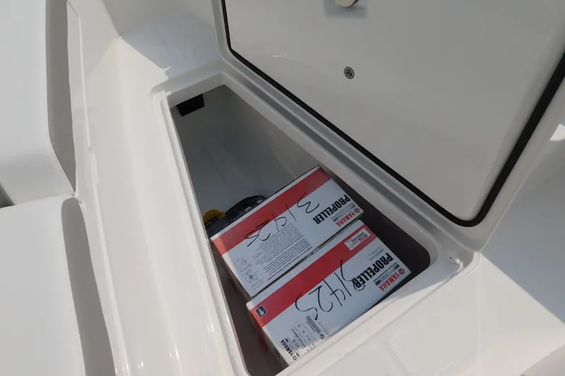 Slide: The Image of Storage compartment on a 2026 Regulator 31 boat with Yamaha propeller boxes. - 34