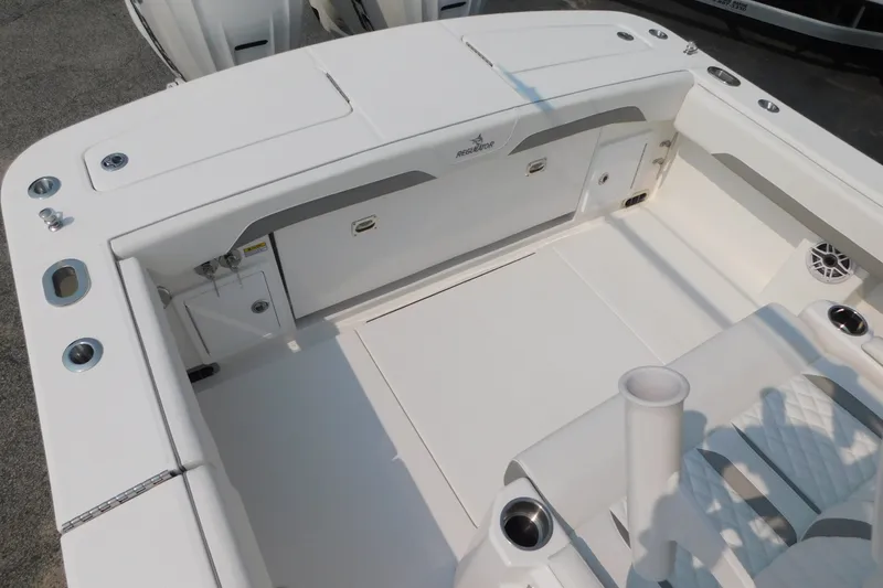 Slide: The Image of 2026 Regulator 31 boat interior with storage compartments and seating area. - 15