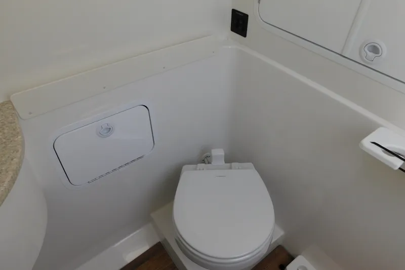 Slide: The Image of 2026 Regulator 31 boat bathroom with modern toilet and storage compartment. - 47