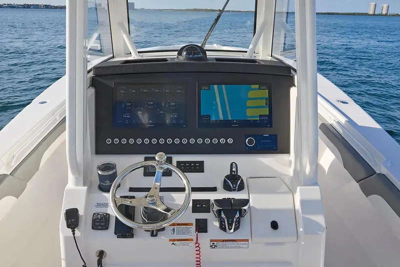 Slide: The Image of Manufacturer Provided Image: Helm of 2026 Regulator 31 boat with advanced navigation system and controls. - 59