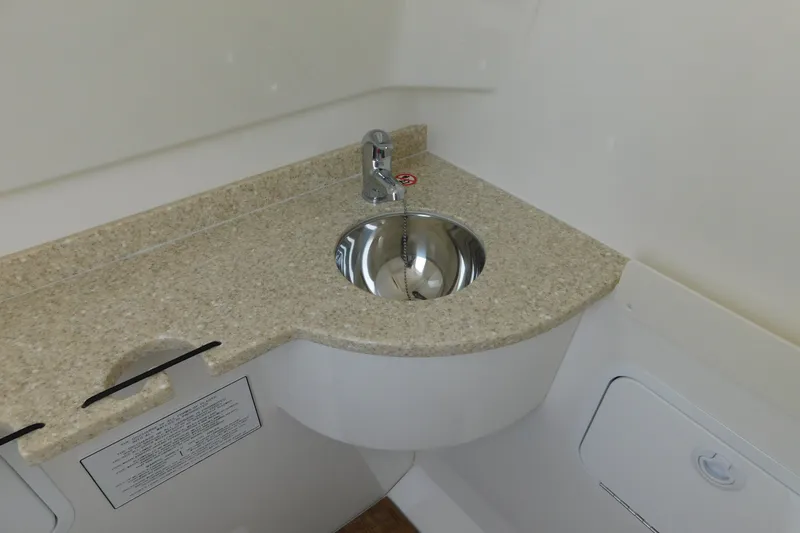 Slide: The Image of Compact sink area in 2026 Regulator 31 boat, featuring a sleek countertop design. - 42