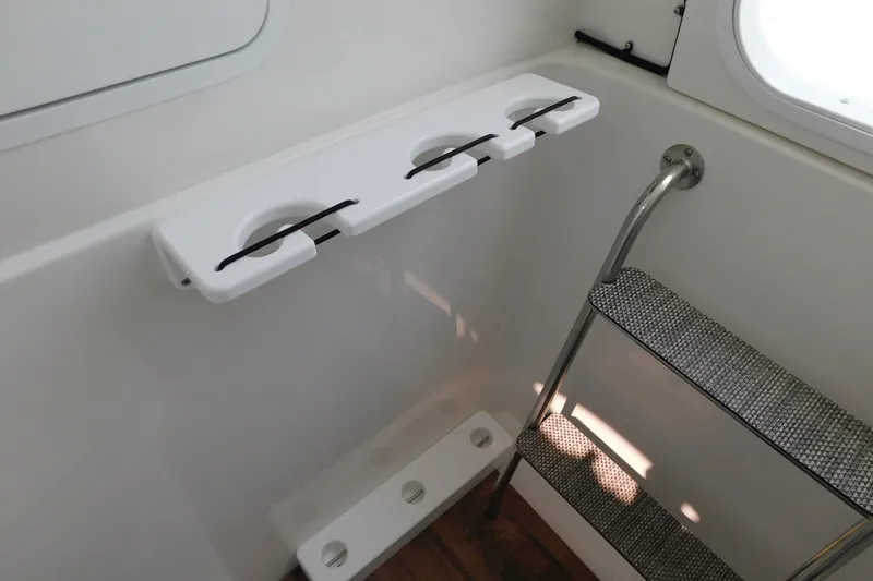 Slide: The Image of Interior of 2026 Regulator 31 boat with ladder and cup holders. - 40