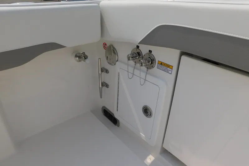 Slide: The Image of 2026 Regulator 31 boat interior, featuring utility access panel and control fittings. - 14